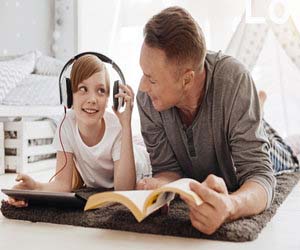 Child Reading Audiobooks with Father